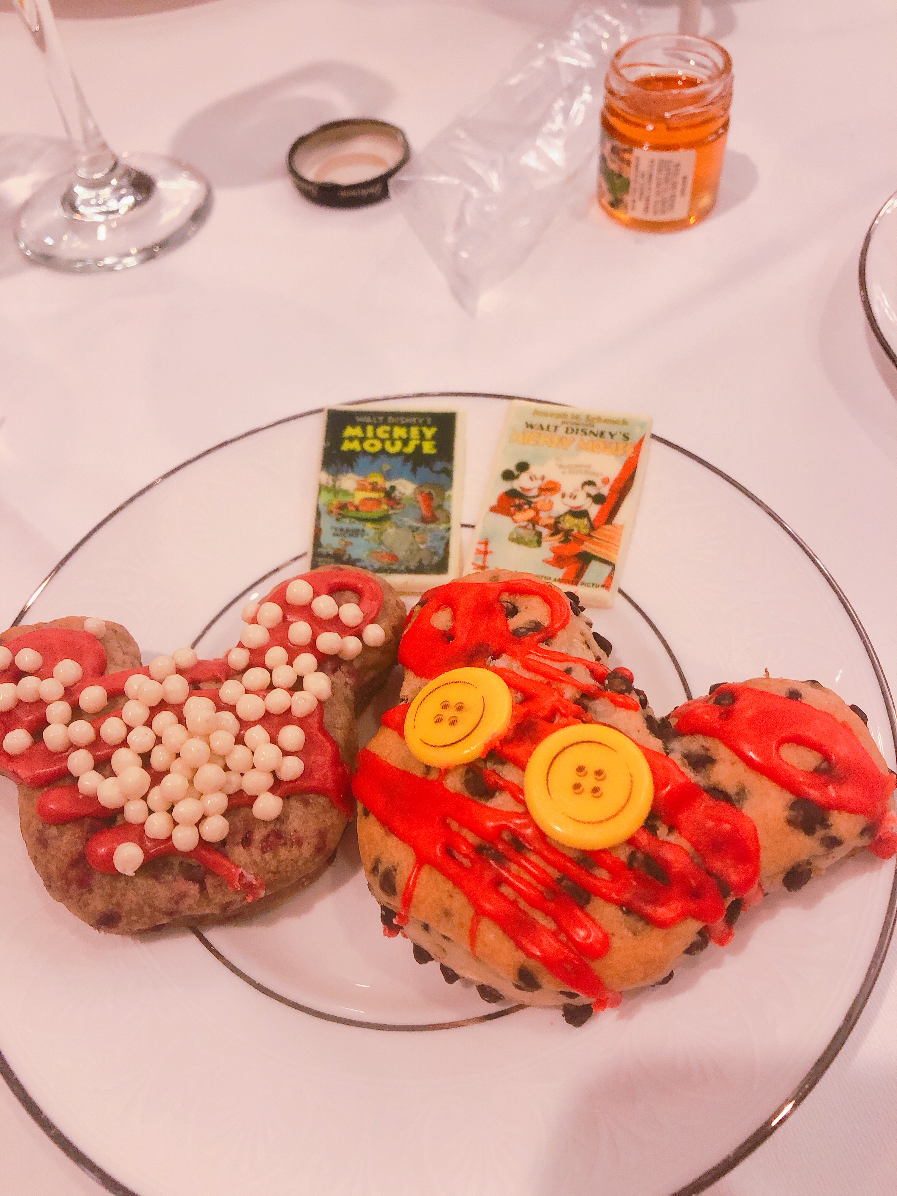 A picture of the Mickey and Minnie themed scones offered at the Mickey's Tea Party Celebration. the Minnie scone was raspberry and the Mickey scone was chocolate chip.